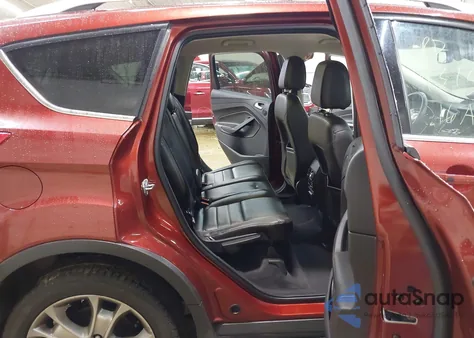 2016 Ford Escape Titanium z USA, uszkodzony, nr VIN 1FMCU9J94GUB12785